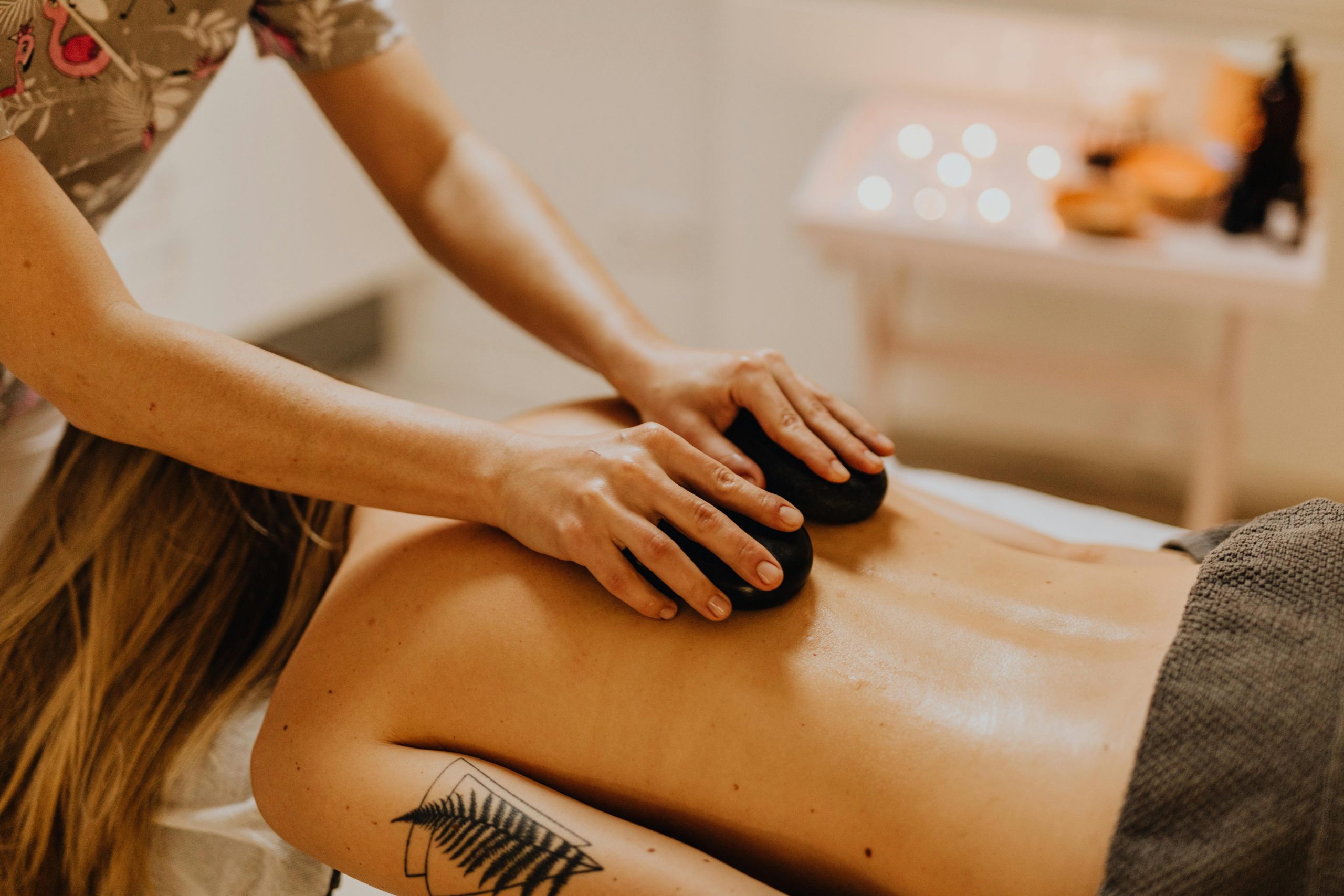 A calming massage therapy session with hot stones for relaxation and wellness.